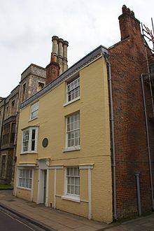 Attached house with a tan facade