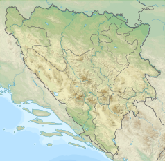 Mapa konturowa Bośni i Hercegowiny, po lewej znajduje się czarny trójkącik z opisem „Veliki Troglav”