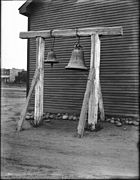 Two old San Diego Mission bells hanging in a wooden timber frame, ca.1880-1903 (CHS-1627).jpg