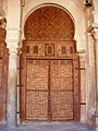 One of the seventeen carved-wood doors of the prayer hall