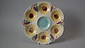 Oyster plate, 9.6 in, coloured glazes, c. 1881, sunflower pattern