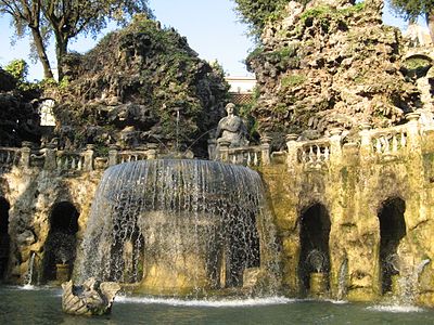 The statue of the Sibyl Albunensa over the fountain, and the artificial mountains behind it.