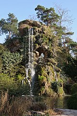 Artificial waterfall in the park of Bagatelle, France.