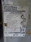 COVID-19 Infographic in Asi and Filipino in a storefront in Banton, Romblon, Philippines.jpg