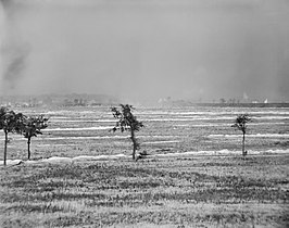 The British 46th (North Midland) Division attacking the Hohenzollern Redoubt during the Battle of Loos. A cloud of smoke and gas appears in the centre and left. 13 October 1915