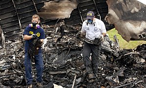 NTSB investigators remove the recorders from UPS 1354 (9518908718).jpg