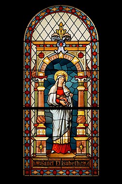 Vitral do século XVIII representando Santa Isabel da Hungria. Museu da cidade de Liubliana, Liubliana, Eslovênia. Santa Isabel foi uma princesa do Reino da Hungria e landgravina da Turíngia na Alemanha. Isabel casou-se aos 14 anos e ficou viúva aos 20. Após a morte do marido, ela recuperou o dote, usando o dinheiro para construir um hospital onde ela mesma atendia os enfermos. Tornou-se um símbolo da caridade cristã após a sua morte, aos 24 anos, canonizada em 25 de maio de 1235. É venerada como santa pela Igreja Católica. Foi um dos primeiros membros da Ordem Franciscana Secular e hoje é homenageada como sua padroeira. (definição 3 146 × 3 146)