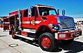 A red CalFire wildland fire engine in the sunlight