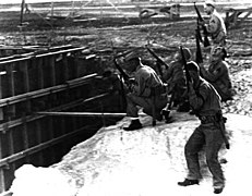 Marines with rifles at MCAS Ewa during Japanese attack 1941.jpg