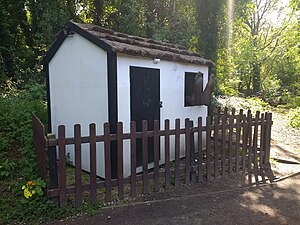 Depiction of Middleton's house at Speke Hall. His feet are hanging through the window and when approached snoring is heard.