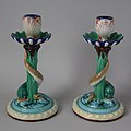 Candlesticks, coloured glazes, moulded in relief, c. 1880, naturalistic in style with historical references