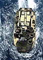 A Marine AAV maneuvers while preparing to enter the well deck aboard the amphibious assault ship USS Kearsarge (LHD 3) in the Persian Gulf on July 23, 2005.