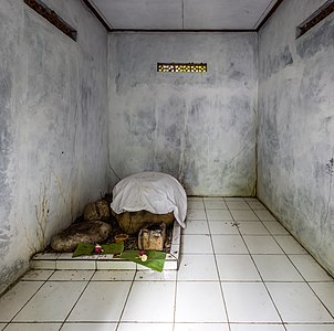 Petilasan Carangandul, in Taman Sari - the stone under the sheet is commonly held to be someone's head