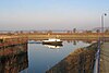 A water-filled dock with stone walls