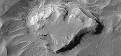 Close-up of one of mesas in previous photo showing layers. Mesa may be the remains of a lake in which sediments were deposited. Taken by HiRISE under the HiWish program.