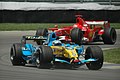 Alonso at the United States GP, pursued by Michael Schumacher