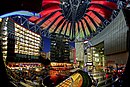 Interior view of Sony Center atrium, Berlin, 2000 by Helmut Jahn, during artificial sunset sequence; lighting design Yann Kersalé