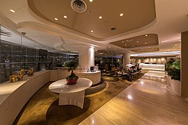 Interior view of the Wangz hotel lounge with shining parquet curved ceiling and round table Singapore.jpg