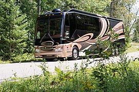 Bodi buatan Millennium Luxury Coaches dengan sasis buatan Prevost. Digunakan sebagai bus pariwisata.