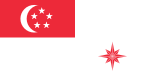 A red rectangle at the top left corner of the flag, charged with a white crescent and five white stars arranged in a pentagon. The rest of the flag is coloured white. At the bottom right part of the flag is an eight pointed star that is red.