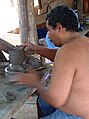 Potter at Guatil, Costa Rica, using a hand-powered potter's wheel, 2003.