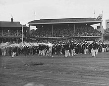 Ron Clarke carrying the Olympic Torch during opening ceremony at Melbourne Olympic Games.jpg