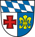 Landkreis Schwabmünchen (–1972) Unter Schildhaupt mit den bayerischen Rauten gespalten von Silber und Blau; vorne ein rotes Tatzenkreuz, hinten eine goldene heraldische Lilie.