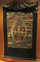 Avalokiteshvara sous la forme d'Ekadashamukha. Tibet, XIXe siècle. Thangka, détrempe sur toile, bordure soie, H. 49 x L. 35,5 cm[6].