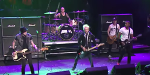 Sum 41 performing in Cleveland, Ohio in 2015. Left to right: Jason McCaslin, Frank Zummo, Deryck Whibley, Tom Thacker and Dave Baksh