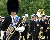 The U.S. Navy Band shown at ease; Drum-Major in front.