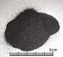 A small heap of uniform black grains smaller than 1mm diameter.