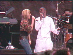 Dido (left) performing with Youssou N'Dour in Hyde Park, London in 2006