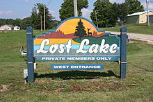 Colorful sign on grass for Lost Lake that leads into Lost Nation, Illinois, USA