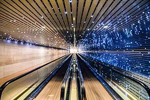 Moving walkway and light sculpture in concourse beneath 4th Street connecting East and West Buildings (2016)