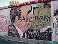 The Berlin wall has become a Mecca for graffiti writers. Featured here is an image of Leonid Brezhnev and Erich Honecker making out. The words at the top read "God! help me stay alive." Image taken in 2005.