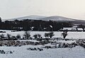 The tomb is visible from afar on the summit, as is its sister cairn on Seefingan