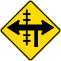 (W15-2/PW-13.2) Railway level crossing on controlled T-junction to left