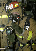 US Navy 080122-N-4649C-074 The nozzleman on a fire team simulates cooling a hot spot during a fire drill aboard the guided-missile cruiser USS Shiloh (CG 67).jpg