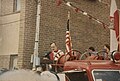 George H.W. Bush (Texas) speaking in front of the Polish flag