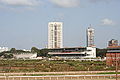 The pavilion of the Mumbai Race Course. The tall buildings in the background are in the central Mumbai area of Parel. This area is undergoind rapid transitions as abandoned mills are being converted to residential, commercial and retail spaces.