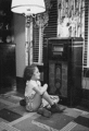 Little girl listens to radio (Rural Electrification Administration)