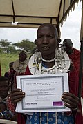 Maasai women shows certificate of accomplishment (6595764029).jpg