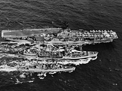 USS Cimarron (AO-22) replenishes USS Hornet (CV-12) and USS Nicholas (DD-449), 1966.jpg