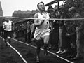 Adolf Dassler egy futóverseny befutóján