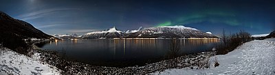 Thumbnail for File:Aurora borealis above Storfjorden and the Lyngen Alps in moonlight, 2012 March.jpg