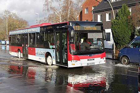 A bus in a flooded street