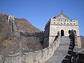 A stone wall going uphill with towers spaced along it (from Human history)