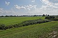 L'Schlenze quasi desaparegut sota la vegetació. Al segon pla: l'Elba.