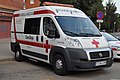 Ambulance of the Creu Roja (Cruz Roja, Spanish Red Cross), Spain), with "AMBULANCIA" in mirror writing ("AICNALUBMA")