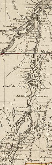 The map is oriented with north to the top. The lower section of the map shows Saratoga, New York and Fort Edward, on the Hudson River. Red markers depict the position of John Burgoyne's army near Saratoga at the time of its surrender in 1777. A line of mountains is shown to the right of the Hudson, extending northward but eventually bending off the map to the east. North of Fort Edward are Fort George, at the southern end of Lake George, and Skenesborough, near the southern end of Lake Champlain. About one third of the way up the map, Lake George joins with Champlain, and Fort Ticonderoga is shown at the northwest side of the junction. Lake Champlain extends to the north and is dotted with islands. There is a red line marking the boundary between New York and Quebec, and the upper third of the map shows the Richelieu River extending north to meet the Saint Lawrence River at Sorel, with Montreal southwest of that point.